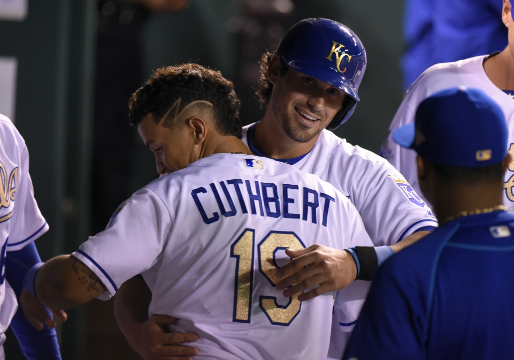 Brett Eibner #12 of the Kansas City Royals celebrates with Cheslor Cuthbert #19 after scoring in the seventh inning against the Chicago White Sox at Kauffman Stadium