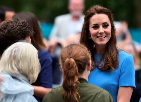 Britain's Catherine Duchess of Cambridge meets guests at the Patron's Lunch a special street party outside Buckingham Palace in London