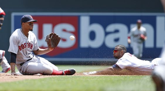 Nunez right safely steals second base as Boston Red Sox shortstop Xander Bogaerts left gets the throw from home while off the base during the first inning of a baseball game in Minneapolis Sunday