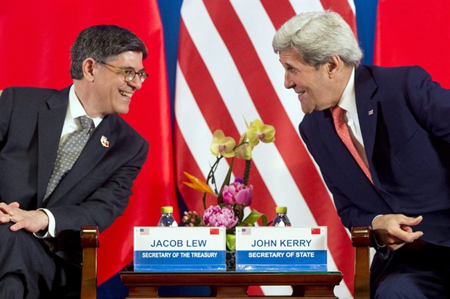 U.S. Treasury Secretary Jacob Lew left and U.S. Secretary of State John Kerry attend the opening session of the U.S.-China Strategic and Economic Dialogues at Diaoyutai State Guesthouse in Beijing Monday