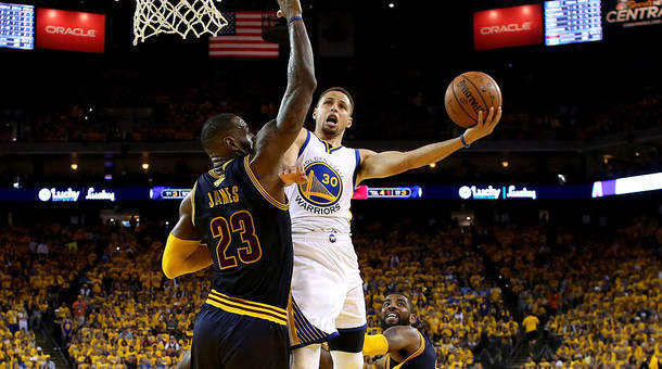 Stephen Curry #30 of the Golden State Warriors goes up for a shot against Le Bron James #23 of the Cleveland Cavaliers in the first half in Game 2 of the 2016 NBA Finals at ORACLE Arena