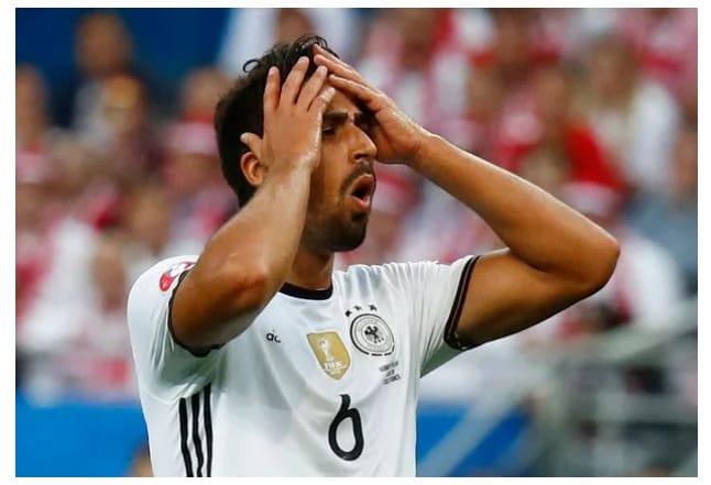 Khedira has his hands in head as he loses a chance against Poland