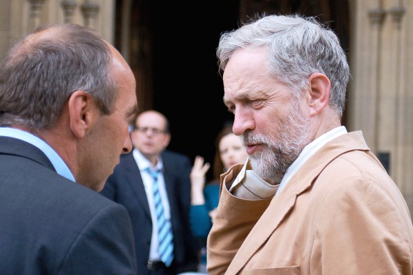 Labour's Jeremy Corbyn talks with reporters outside Parliament in London England