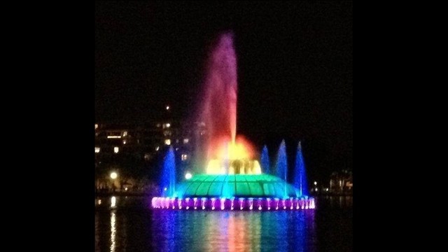 Lake Eola fountain lit in rainbow colors as a symbol of support for mass shooting victims