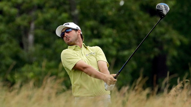 Andrew Landry watches his tee shot fourth tee during the first round of the U.S. Open golf championship at Oakmont Country Club on Thursday