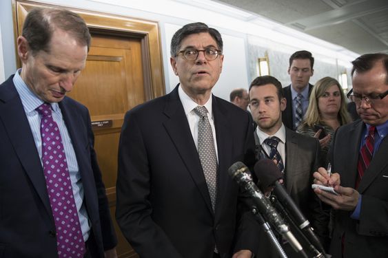 Lew joined by Sen. Ron Wyden D-Ore. ranking member of the Senate Finance Committee left speaks to reporters on Capitol Hill in Washington Tuesday