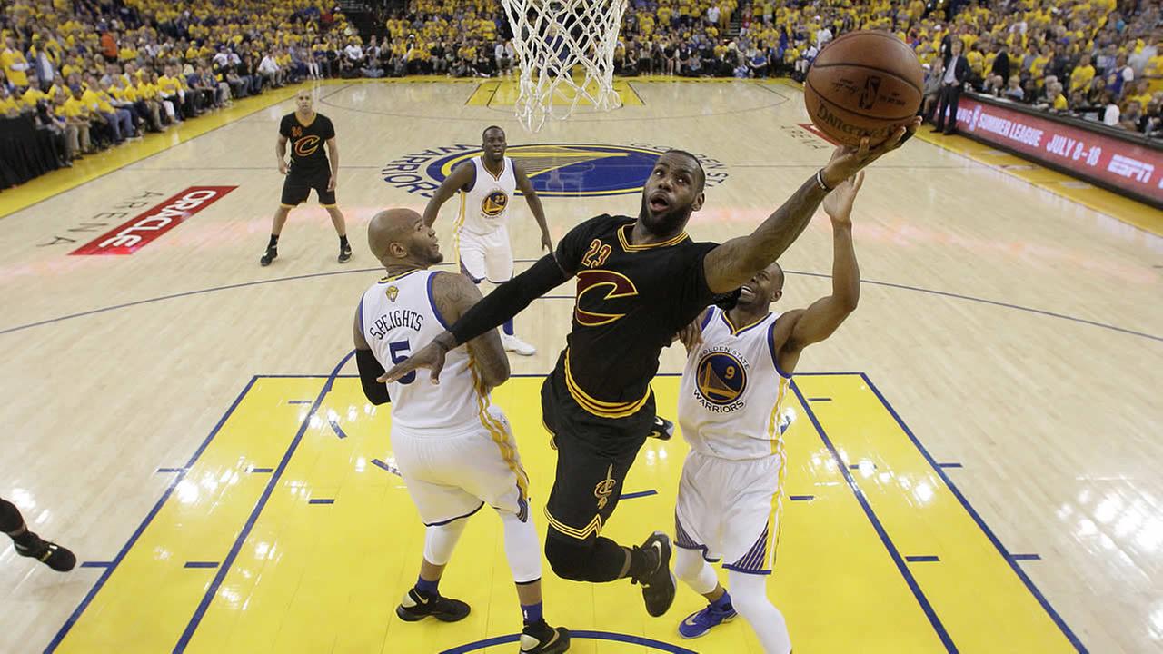 Cavaliers forward Le Bron James shoots against the Warriors during Game 7 of basketballs NBA Finals in Oakland Calif. Sunday