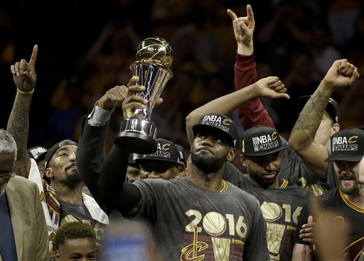 Cleveland Cavaliers forward Le Bron James center celebrates with teammates after Game 7 of basketball's NBA Finals against the Golden State Warriors in Oakland Calif. Sunday