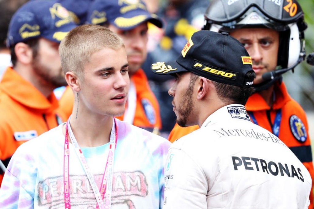 Lewis Hamilton right is congratulated by Justin Bieber at the podium after winning the Monaco Grand Prix