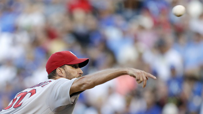 St. Louis Cardinals pitcher Adam Wainwright throws to a batter in the first inning of a baseball game against the Kansas City Royals at Kauffman Stadium in Kansas City Mo. Monday