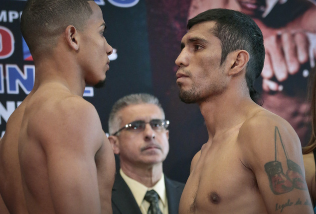 Puerto Rico's Felix Verdejo left and Mexico's Juan Jose Martinez right pose in a face-off after their weigh-in Friday