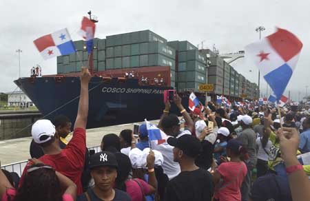 Chinese-chartered merchant ship Cosco Shipping Panama crosses the new Agua Clara Locks during the inauguration of the expansion of the Panama Canal in Colon 80 kilometers from Panama City on June 26. AFP