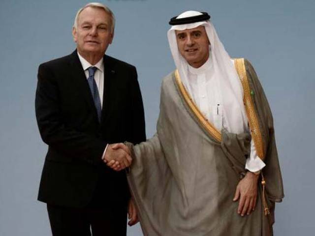 French Foreign Minister Jean Marc Ayrault shakes hands with Saudi Foreign Minister Adel al Jubeir prior to an international and interministerial conference in a bid to revive the Israeli Palestinian peace process in Paris France