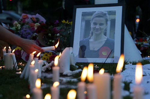 People light candles at the tributes in Parliament Square central London on Friday in remembrance of Labor MP Jo Cox who was killed on a street in Birstall on Thurdsay. AFP