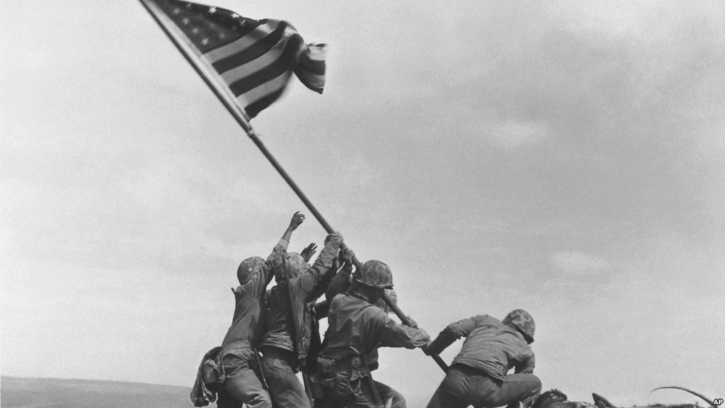 FILE- U.S. Marines raise the American flag atop Mount Suribachi Iwo Jima Japan Feb. 23 1945. The Marines Corps said Thursday that Private First Class Harold Schultz of Detroit was in the