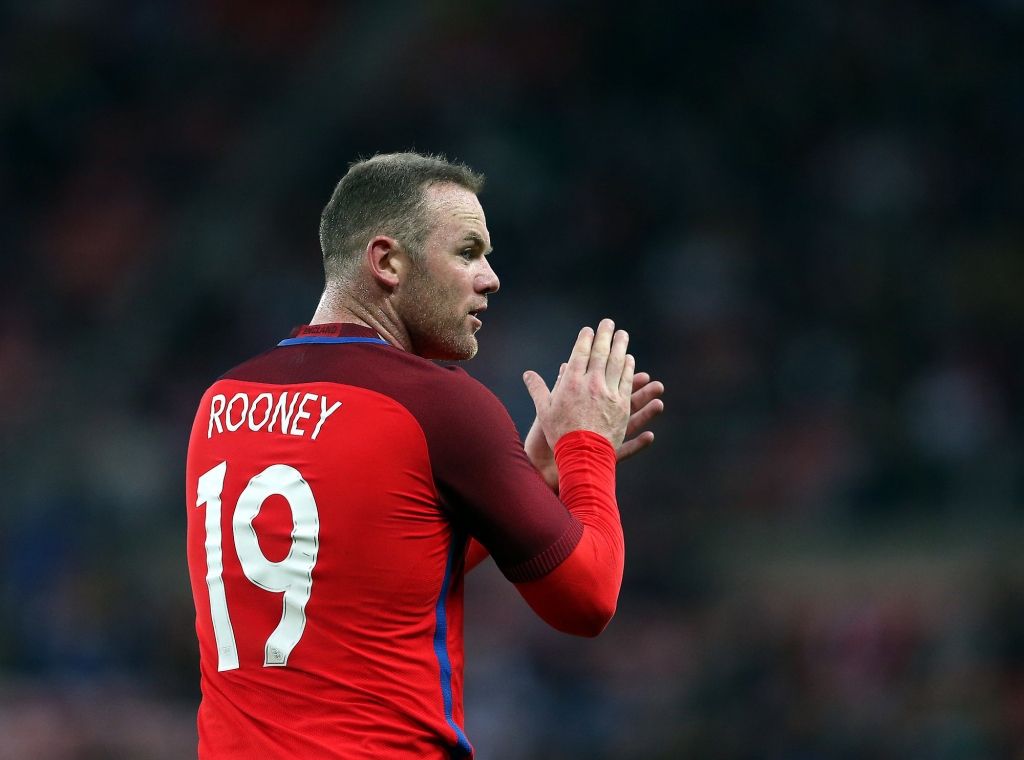 England's captain Wayne Rooney applaudes to his teammates during the international friendly soccer match between England and Australia at the Stadium of Light Sunderland England Friday