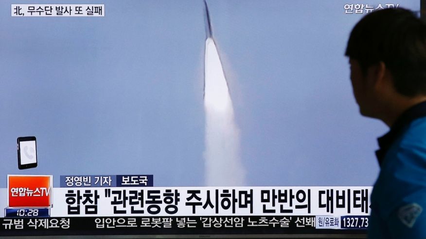 A man watches a TV news program reporting about a missile launch of North Korea at the Seoul Train Station in Seoul South Korea