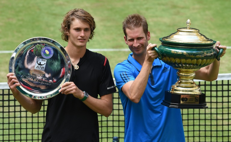 AFP  Carmen Jaspersen Florian Mayer of Germany celebrates his win with compatriot Alexander Zverev at the ATP tournament in Halle western Germany