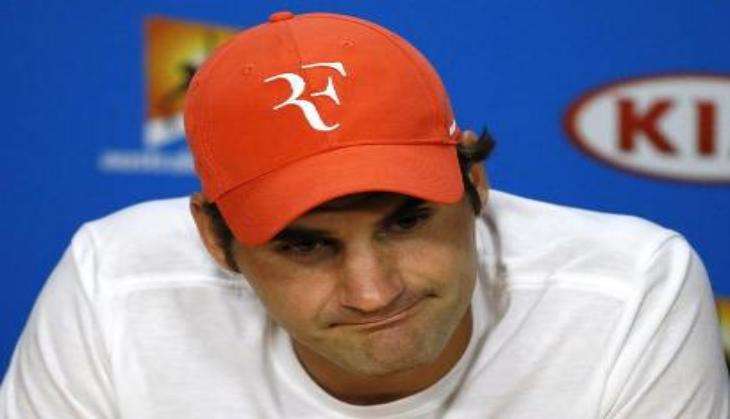 Roger Federer from Switzerland plays against Jan-Lennard Struff from Germany during the ATP Tournament in Halle