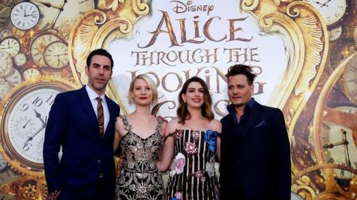 Sacha Baron Cohen Mia Wasikowska Anne Hathaway and Johnny Depp pose at the premiere of 'Alice Through the Looking Glass&#039