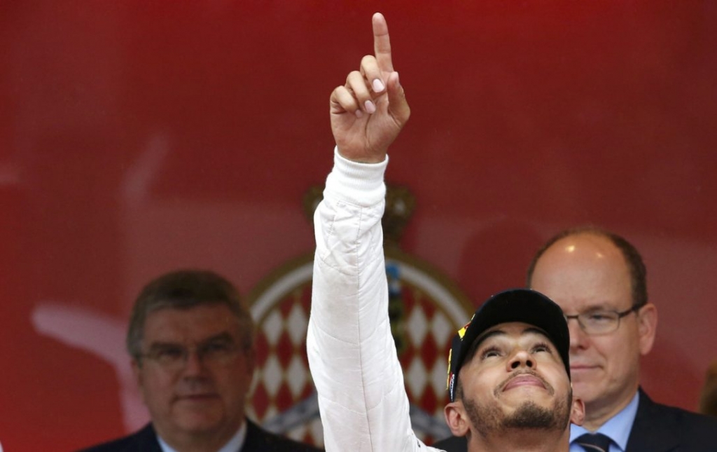 Mercedes F1 driver Lewis Hamilton celebrates next to Prince Albert II of Monaco right after winning the Monaco Grand Prix