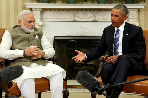 US President Barack Obama extends a hand to shake with Prime Minister Narendra Modi after their remarks to reporters following a meeting in the Oval Office at the White House in Washington US on 7 June