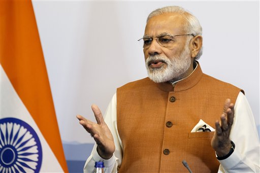 Indian Prime Minister Narendra Modi left speaks during a joint news conference after a bilateral meeting with Swiss President Johann Schneider Ammann and a round table with Swiss Economic representatives in Gene