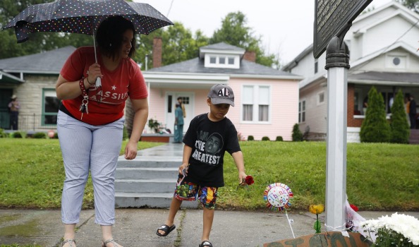 Mourners leave flowers outside Muhammad Ali's childhood home following his death