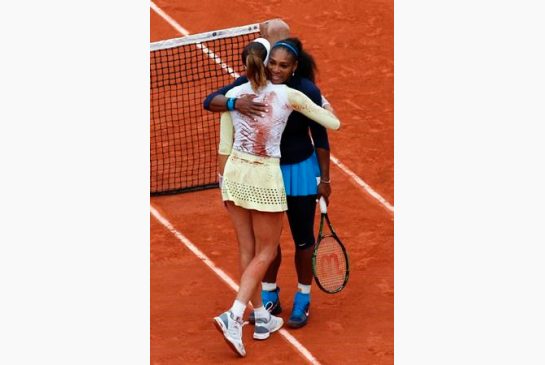 Spain's Garbine Muguruza hugs Serena Williams of the U.S. after their final match of the French Open tennis tournament at the Roland Garros stadium Saturday