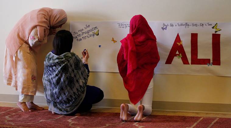 Members of the Louisville Islamic Center write messages on a memorial banner as they pay their respect to Muhammad Ali the former world heavyweight boxing champion after he died at the age of 74 on Friday at the Islamic Center in Louisville Kentucky U