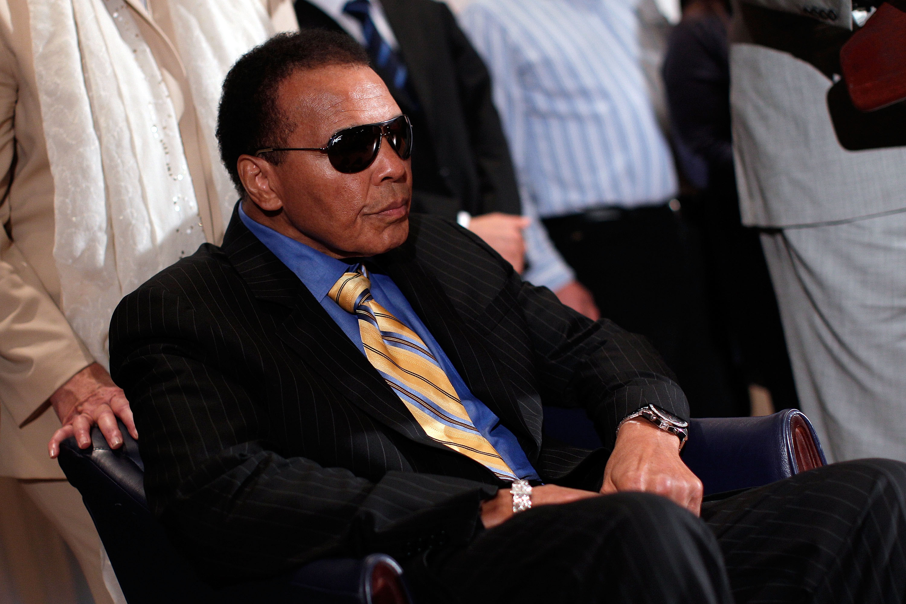 Muhammad Ali attends a news conference at the National Press Club