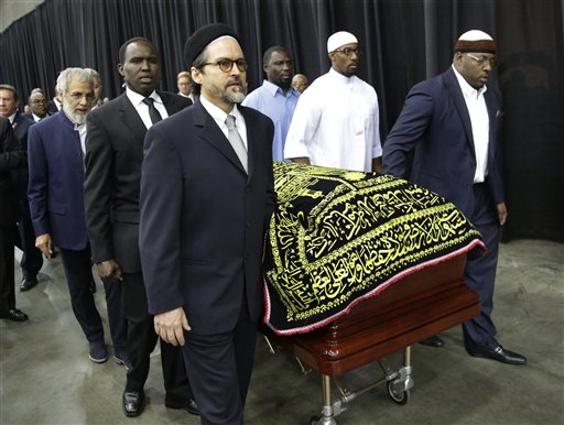 Muhammad Ali's casket is escorted by pallbearers for his Jenazah a traditional Islamic Muslim service in Freedom Hall Thursday