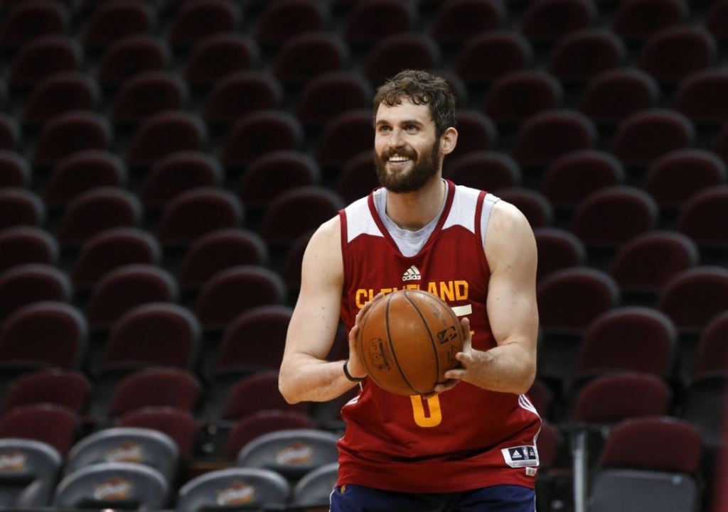 Cleveland Cavaliers forward Kevin Love smiles during practice Thursday but still must be cleared by doctors before he can play