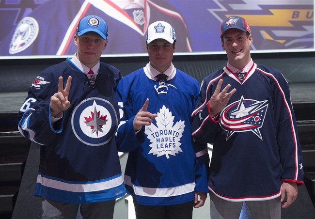 The NHL top three draft picks Patrik Laine of the Winnipeg Jets left to right Auston Matthews of the Toronto Maple Leafs and Pierre Luc Dubois of the Columbus Blue Jackets pose for