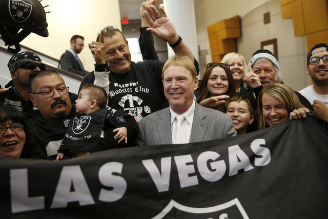 ASSOCIATED PRESS           Oakland Raiders Owner Mark Davis center meets with Raiders fans after speaking at a meeting of the Southern Nevada Tourism Infrastructure Committee April 28 in Las Vegas