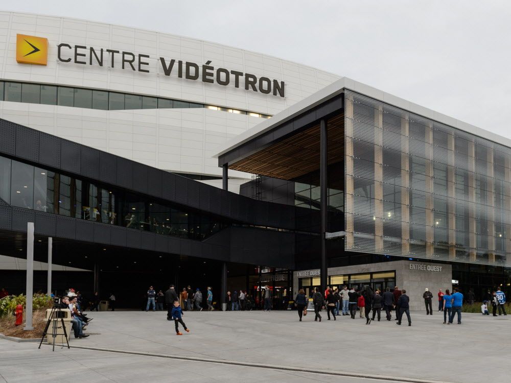 Hockey fans make their way towards the main entrance of the newly built Videotron Centre during the NHL pre-season game between the Montreal Canadiens and the Pittsburgh Penguins