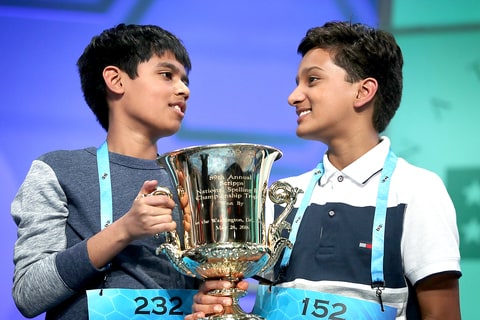 Spellers Nihar Saireddy Janga of Austin TX and Jairam Jagadeesh Hathwar of Corning NY hold a trophy after the finals of the 2016 Scripps National Spelling Bee