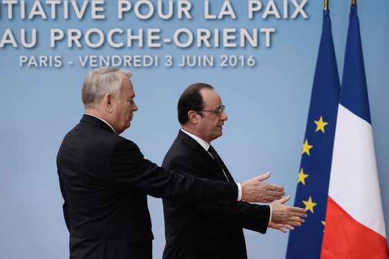 Hollande and his Foreign Affairs minister Jean Marc Ayrault left arrive to attend an international meeting in a bid to revive the Israeli Palestinian peace process in Paris France Friday