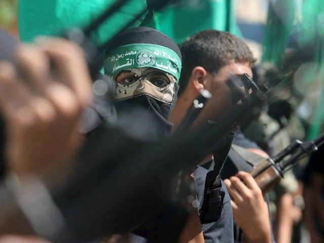 Palestinian Hamas militants take part in a protest against the Israeli police raid on Jerusalem's al Aksa mosque in Khan Yunis