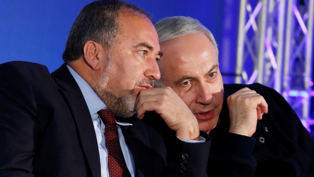 Israel's Prime Minister Benjamin Netanyahu right converses with Avigdor Lieberman in a 2013 file