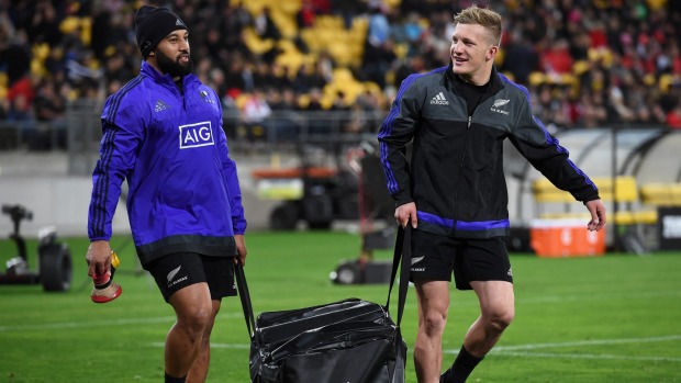 Damian McKenzie right is still smiling as he carries bags to All Blacks training with Lima Sopoaga despite missing