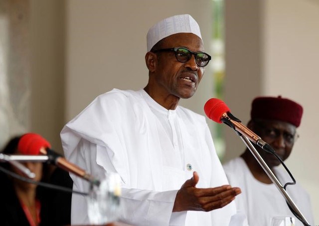 Nigerian President Muhammadu Buhari speaks at a joint news conference with his French counterpart Francois Hollande at the presidential villa in Abuja Nigeria