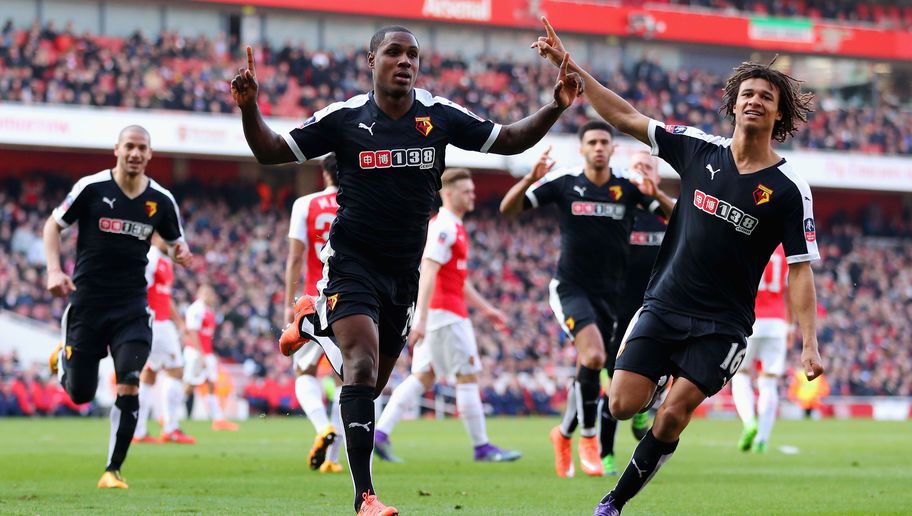 LONDON ENGLAND- MARCH 13 Odion Ighalo of Watford celebrates with team mate Nathan Ake as he scores their first goal during the Emirates FA Cup sixth round match between Arsenal and Watford at Emirates Stadium