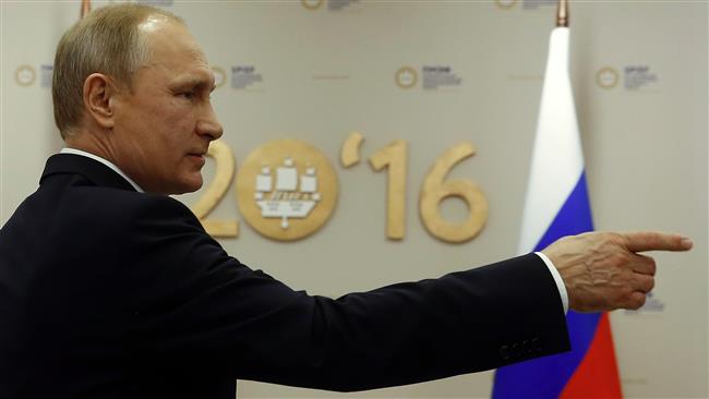 Russian President Vladimir Putin gestures during the St. Petersburg International Economic Forum in Saint Petersburg