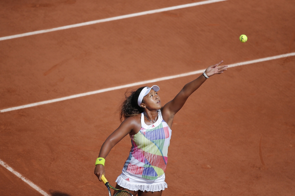 Japan ™s Naomi Osaka returns in her third round match of the French Open tennis tournament against Romania's Simona Halep at the Roland Garros stadium in Paris France Friday