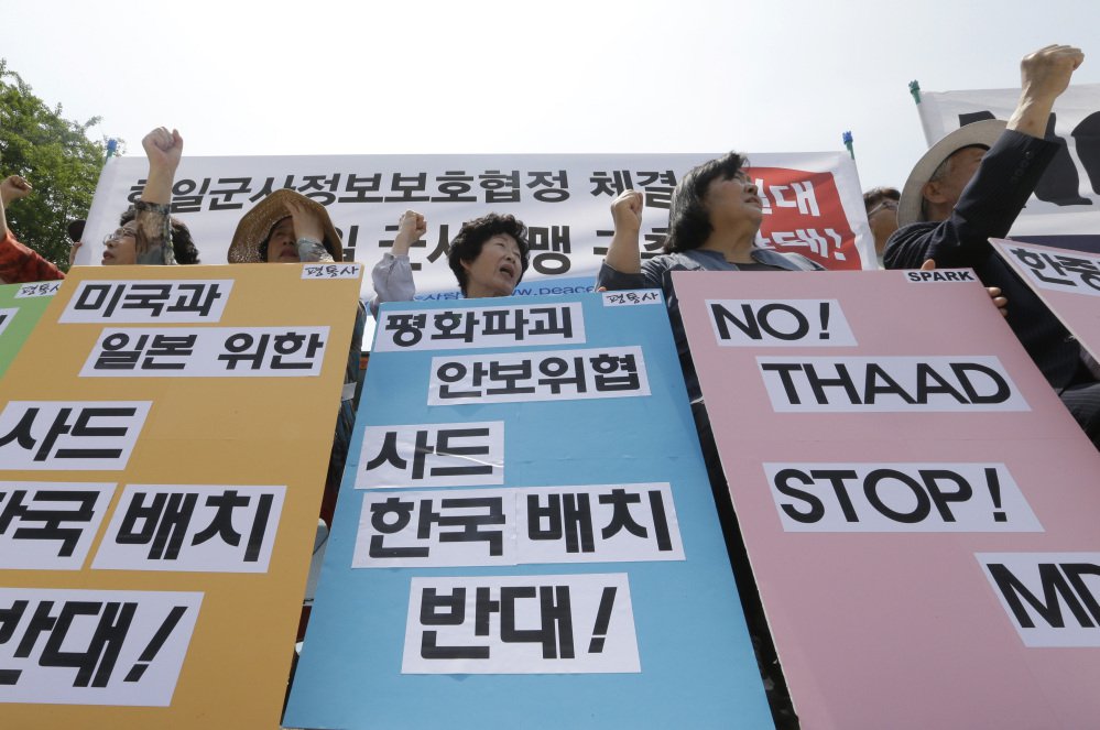 South Korean protesters stage a rally denouncing the United States South Korean and Japanese governments missile policies on North Korea in Seoul South Korea Tuesday