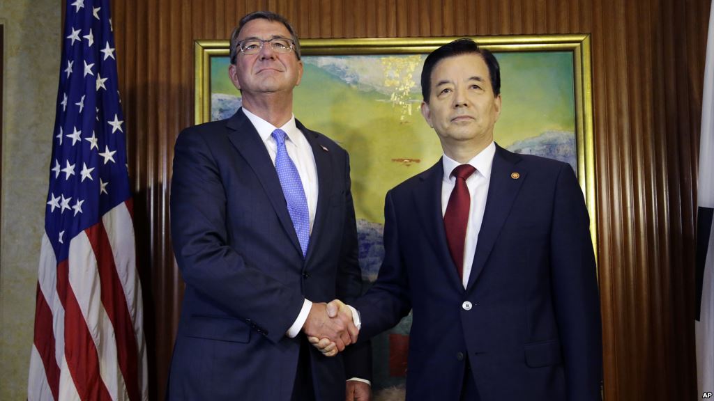 U.S. Defense Secretary Ash Carter left shakes hands with South Korea's Defense Minister Han Min Koo during their bilateral meeting on the sidelines of the 15th International Institute for Strategic Studies Shangri-la Dialogue or IISS Asia Security