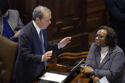 Illinois Senate President John Cullerton D-Chicago left talks to Illinois Sen. Mattie Hunter D-Chicago right while on the Senate floor during the May 31 session at the Illinois State Capitol in Springfield Ill. AP