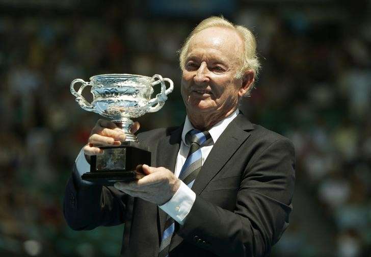 Former Australian tennis player Rod Laver holds a trophy presented to him during a ceremony on Australia Day at the Rod Laver Arena at the Australian Open tennis tournament at Melbourne Park Australia