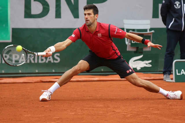 Novak Djokovic returned the ball today in his quarterfinal match against Tomas Berdych at Roland Garros. Michael Euler  AP Click